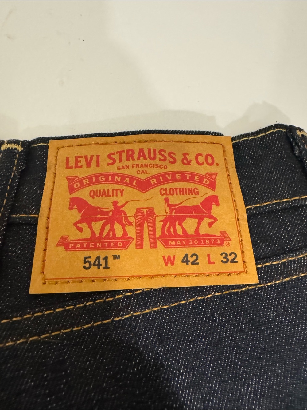 Levi's Men's Jeans in Dark Indigo with Tan Leather Patch